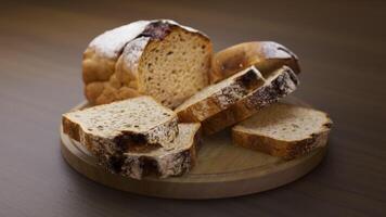 Looping animation around a composition of loaf cake lying on a wooden board. Loop motion. Defocus. Close-up. video