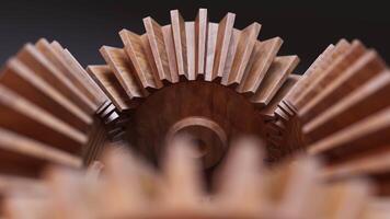Looping animation of a mechanical construction made of wooden gears. Cyclic movement. Close-up. Horizontal composition. Defocus. video