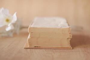 stack of tissue paper on a wooden table photo