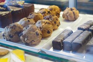 Delicious baked treats in a display case at a local bakery shop photo