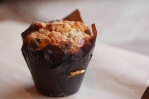 Freshly baked muffin with nuts and seeds on display photo