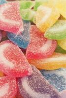 Colorful gummy candies piled together in a vibrant display photo