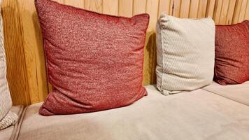 Cozy cushions arranged neatly on a stylish sofa in a warm setting photo