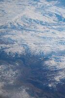 Snowy mountain landscape viewed from high altitude during daytime photo