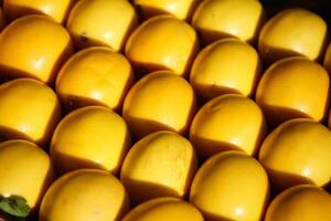 Fresh lemon arranged in a vibrant display at a market photo
