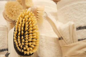 Detail of cleaning brushes and towels organized in a tidy setting photo
