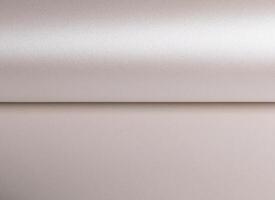 Paper background with pearlescent texture. Smooth satin surface in soft champagne and pale gold photo