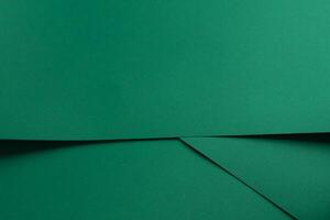 Paper background with matte texture. Folded layered sheets in emerald green, jade green, and fresh photo
