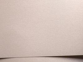 Paper background with satin matte texture. Layered soft overlap, pale gold and champagne tone, clean photo