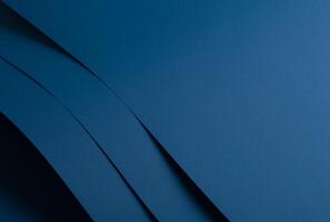 Paper background with matte texture. Layered curved sheets in navy, royal blue, deep blue, and ocean photo