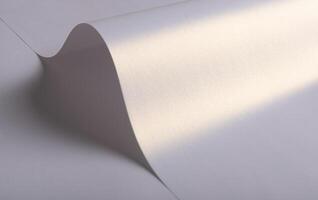Paper background with satin pearlescent texture. Glossy folded curves, smooth surface in pale lilac photo