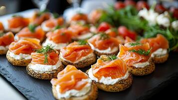 Delicious Smoked Salmon Canapes on Poppy Seed Bread. A close up image of an elegant appetizer spread, perfect for a party or event. photo