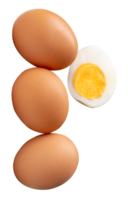 Raw brown chicken eggs and cooked or boiled chicken egg with egg yolk in half in stack isolated in file format png