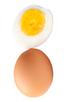 Chicken egg and peeled cooked or boiled egg with egg yolk in half isolated with clipping path in file format png