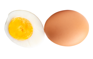 Top view of raw chicken egg and peeled cooked or boiled egg with egg yolk in half isolated with clipping path in file format png