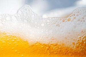 Close up bright orange Oil or beer splash texture and nature waves, Beautiful waves curve and little bubbles smooth for graphic design and background, Oil Bubb. photo