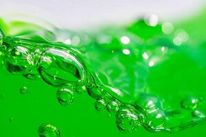 Water wave, close up of vibrant green liquid with bubbles, capturing dynamic movement and freshness. Perfect for backgrounds, beverages, or abstract concepts. soft drink. photo