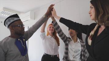A multi-ethnic group of business people with their hands together up, cooperation and teamwork video