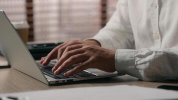 Focused Caucasian male corporate leader employer man broker guy hands typing keyboard computer manager business agent working network laptop in office worker programming businessman company job online photo