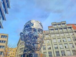 Prague- Czech- 4 april 2024. Statue of Franz Kafka, the work by David Cerny photo