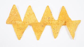 Pattern of tortilla chips isolated on white background photo