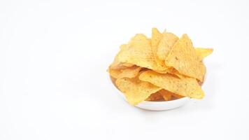 Nachos chips on small plate isolated on white background photo