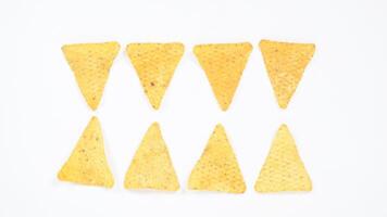 Crispy tortilla chips pattern isolated on white background photo