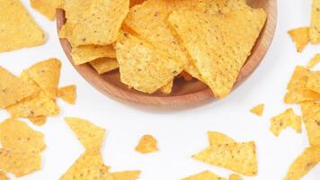 A plate of nachos chips isolated on white background photo