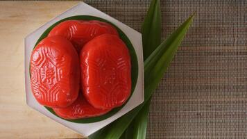 Top view of Kue Mata Kebo means buffalo eye cake, traditional Indonesian snack made from glutinous rice flour, on white platter photo