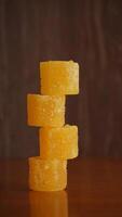 Stack of yellow rock sugar cubes photo