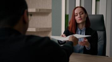 Caucasian businesswoman dissatisfied with cv application of African american man applicant refuse to client decline business documents fail job employment rejected offer in office negative decision no video