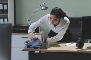 A woman is working on her computer photo