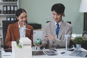 Asian business couple working together on a project photo