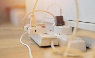 Cropped shot of the power plug, Multiple socket with connected plugs. photo