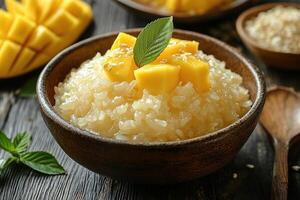 Sticky rice dessert with mango in a rustic bowl on a table photo