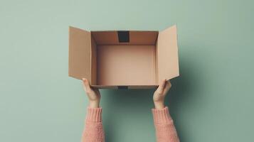 Minimalist cardboard box being held in hands photo