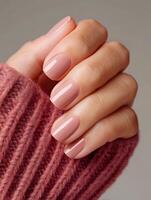 A woman s hand with square shaped varnished nails photo