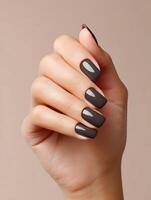Elegant square shaped manicured nails with matte black polish photo