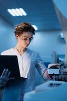 Woman portrait, scientist in lab, chemical engineer and forensics Using Computer. Development Center. Specialist Developing Innovative Medicine For Treating Mental Disorders Or Pain Relief. Vertical photo