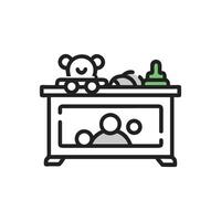 Stylized icon showing baby changing table with accessories vector
