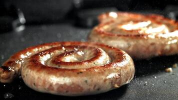 Sausages are grilled. Filmed on a high-speed camera at 1000 fps. High quality FullHD footage video