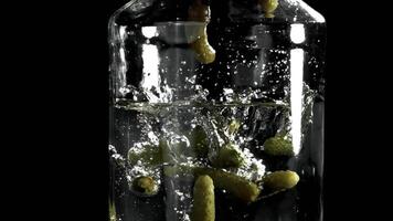 Pickled cucumbers in a jar. Filmed on a high-speed camera at 1000 fps. High quality FullHD footage video