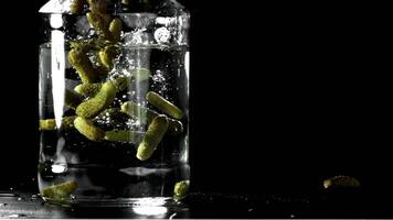 Pickled cucumbers in a jar. Filmed on a high-speed camera at 1000 fps. High quality FullHD footage video