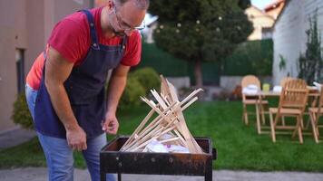 Barbecue preparation in a sunny backyard with friends gathering for a feast video