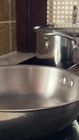 Stainless steel cookware and kitchen utensils on shelf, symbolizing culinary perfection, modern cooking techniques, Thanksgiving meal preparation video