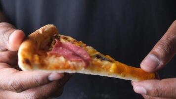 Delicious slice of pizza enjoyed by enthusiast video