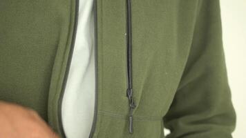 man zip up the jacket closeup video
