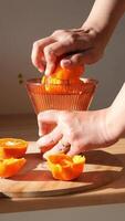 Orange slicing and juicing technique in bright kitchen setting video
