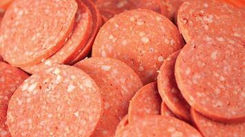 Close-Up of Sliced Pepperoni Sausage with Visible Spices and Textures video