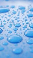 Raindrops create patterns on a blue surface during a rainy afternoon video